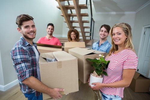 Moving van and packed boxes for a home move in Ardleighgreen