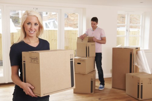 Loading furniture into a removal van on a residential street