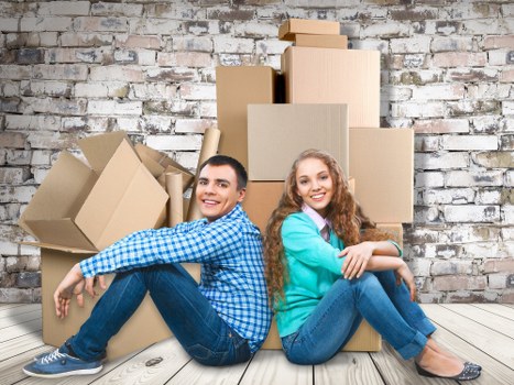 Packing boxes and wrapping household items for a move in Ardleighgreen