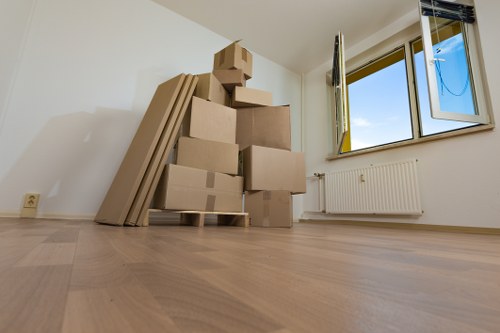Office furniture and IT items being carefully moved for a local business relocation