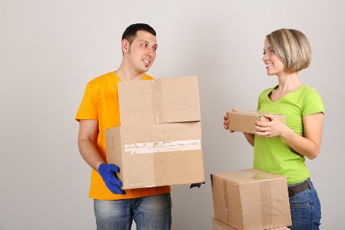 Furniture and office items being moved by a local van team
