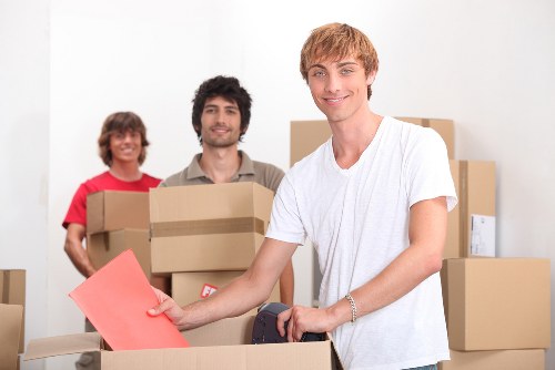 Packed moving boxes and household items inside a removal van
